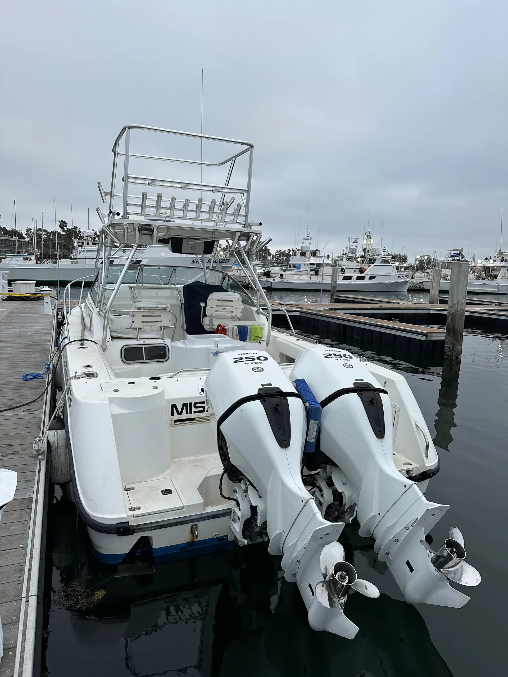 The Kate Elizabeth sportfishing boat with twin white 250 outboard motors docked at her Mission Bay slip